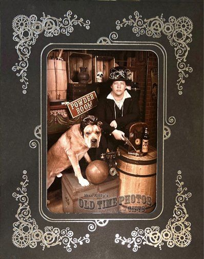 a picture of a man and a dog in a frame that says old time photos