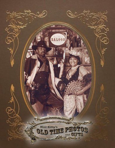 man and woman dressed in Western costumes for an old time photo of a man and woman in front of a saloon