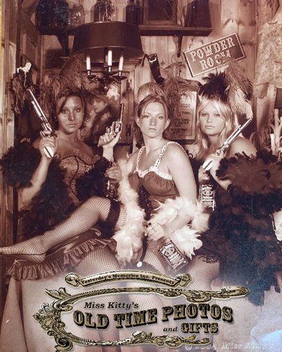 three girls dressed  for a photo at  Miss Kitty's old time photos and gifts