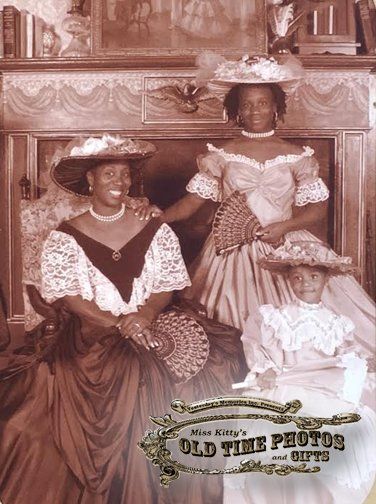 A sepia photo of three women and a child taken by miss kitty 's old time photos