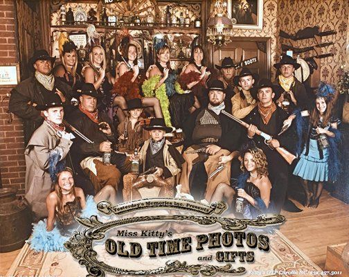 a group of people are posing for an old time photo
