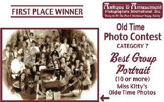 a group of people are posing for a picture in an old time photo contest .