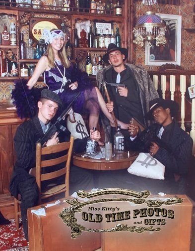 A group of people dressed as 1920s gangsters - Miss Kitty's Old Time Photos and Gifts    Corolla Outer Banks NC