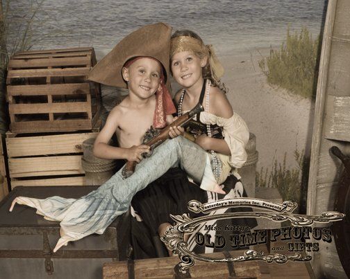 a boy and a girl dressed as pirates are sitting on a trunk Miss Old Time Photos and Gifts    Corolla Outer Banks NC