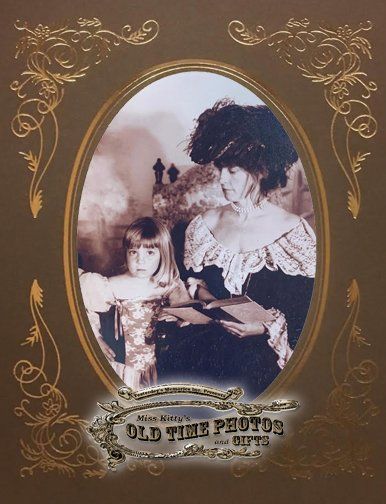 a picture of a woman holding a child is titled old time photos