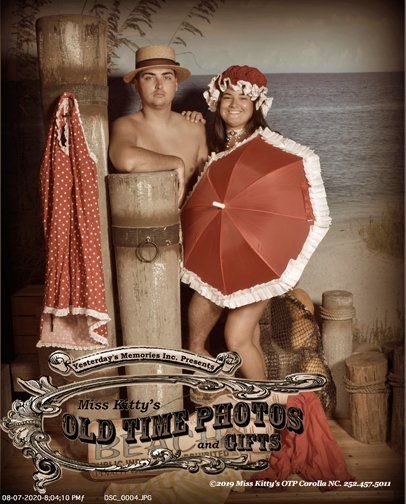 a man and a woman are posing for an old time photo by miss Kitty's 's old time photos and gifts