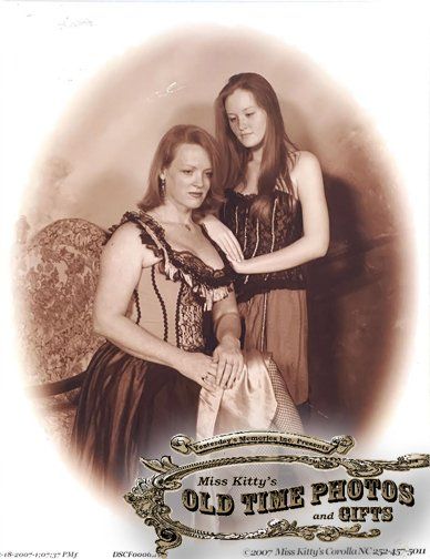 a photo of two women taken by miss kitty 's old time photos and gifts