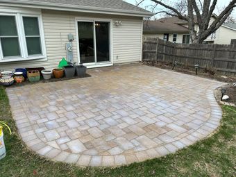 Patio in the back of a house that needs paver cleaning. 