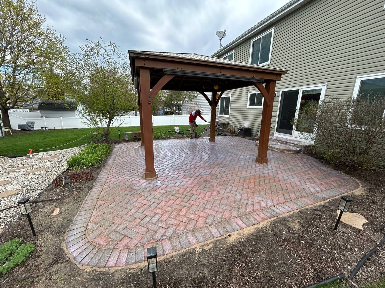 After picture of the same paver patio, now sanded. 