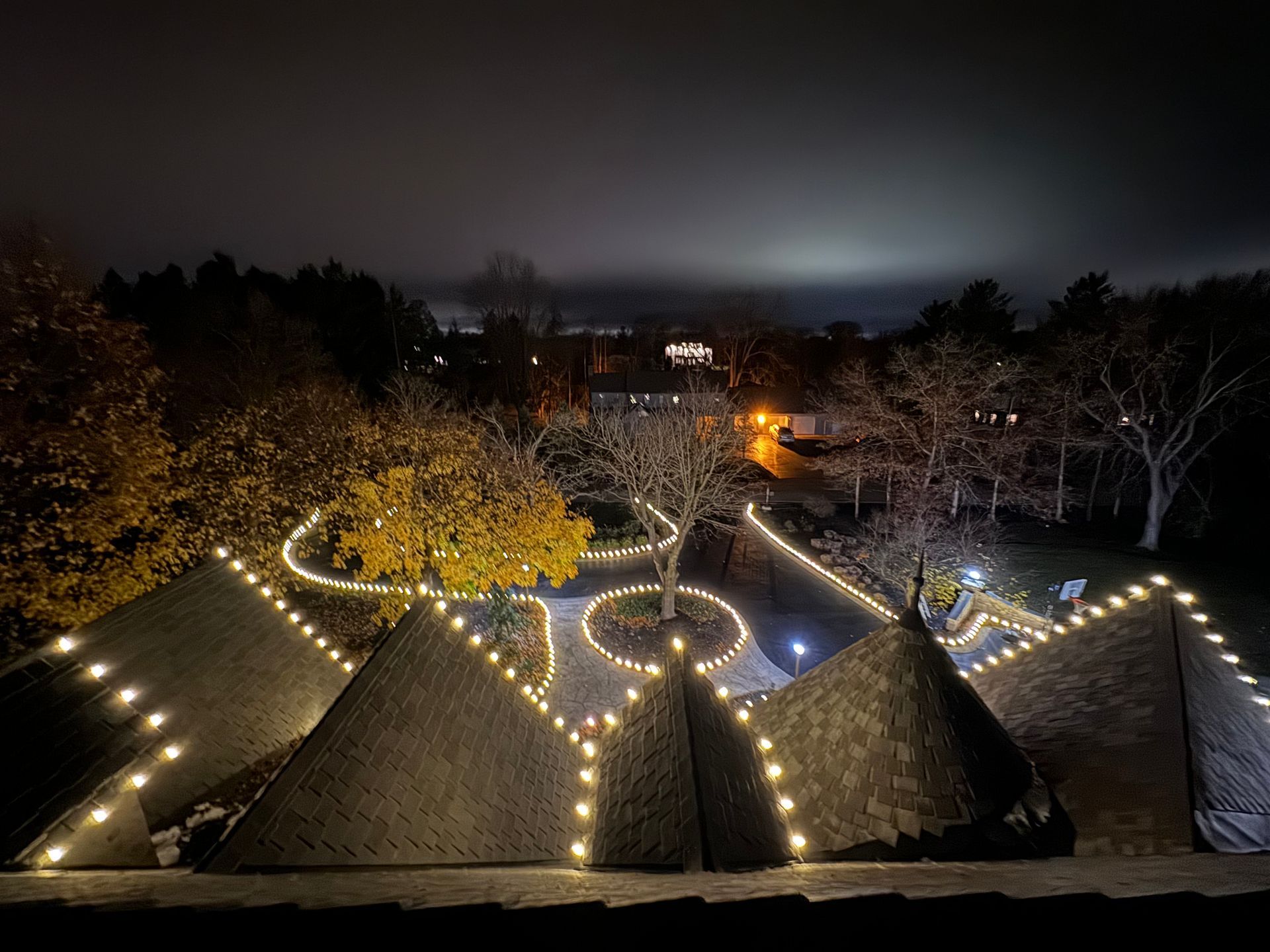 Picture of a home here in Lake Zurich that has accent lighting over its paverstones .
