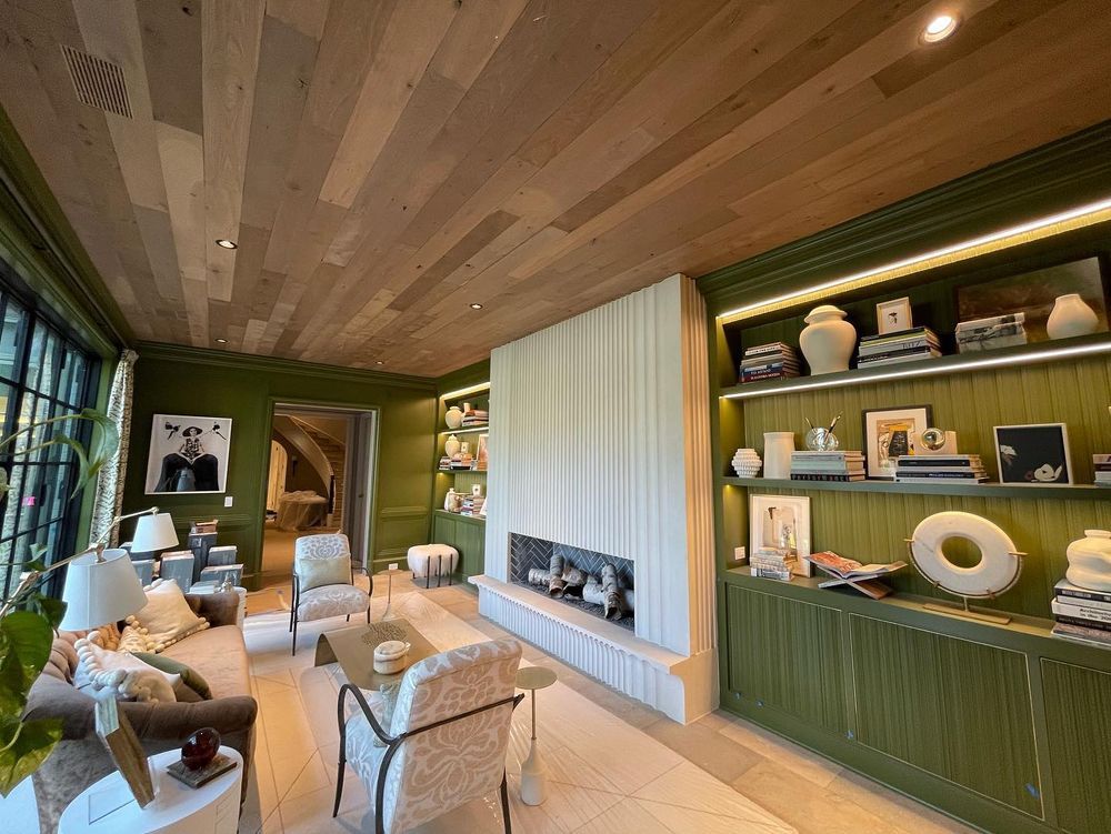 A living room filled with furniture and a fireplace.