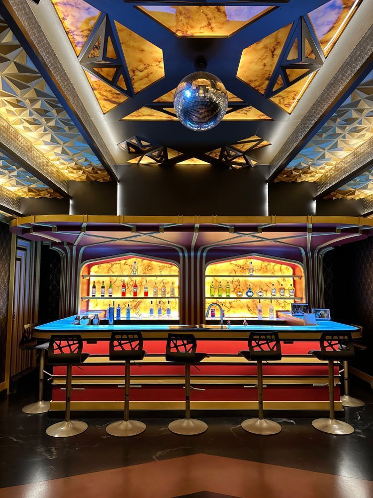 A bar with a disco ball hanging from the ceiling