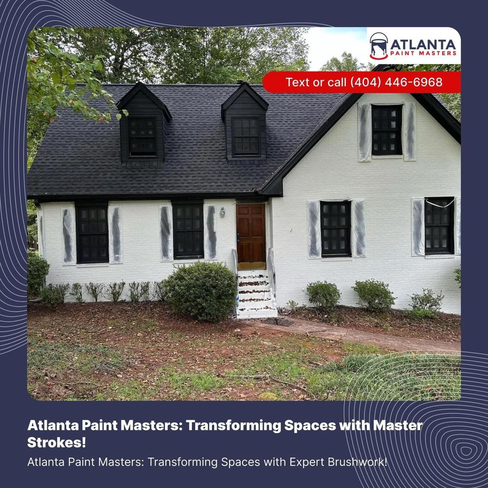 A white house with black shutters and a black roof