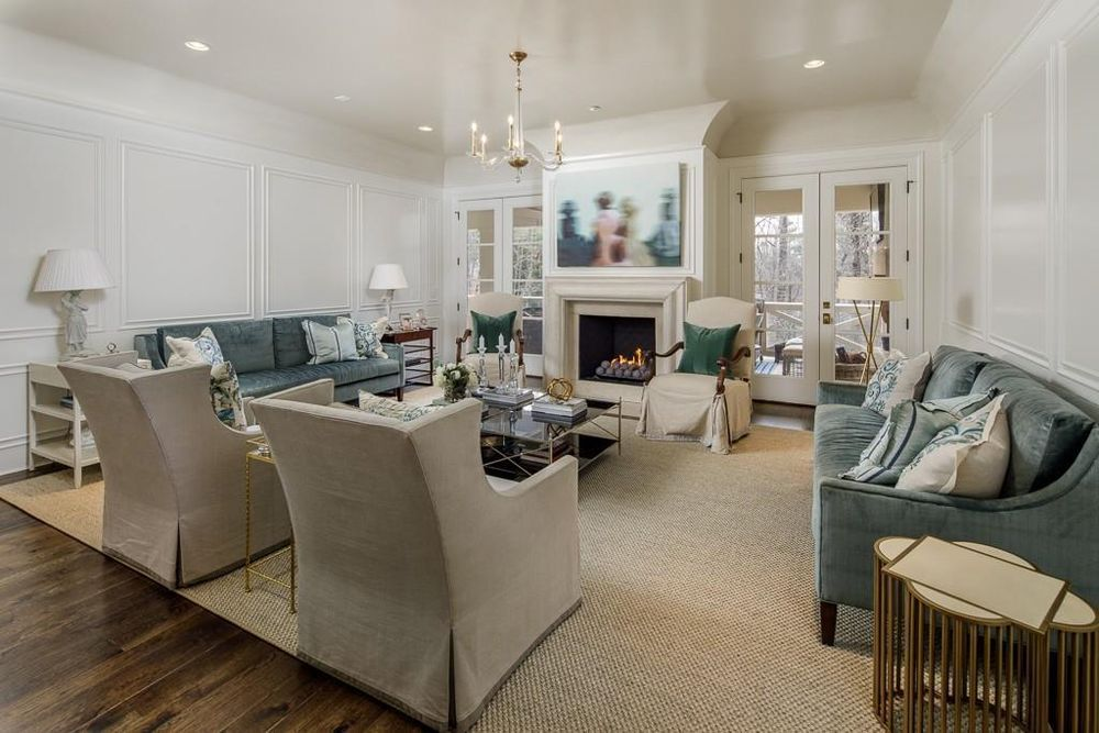 A living room filled with furniture and a fireplace.
