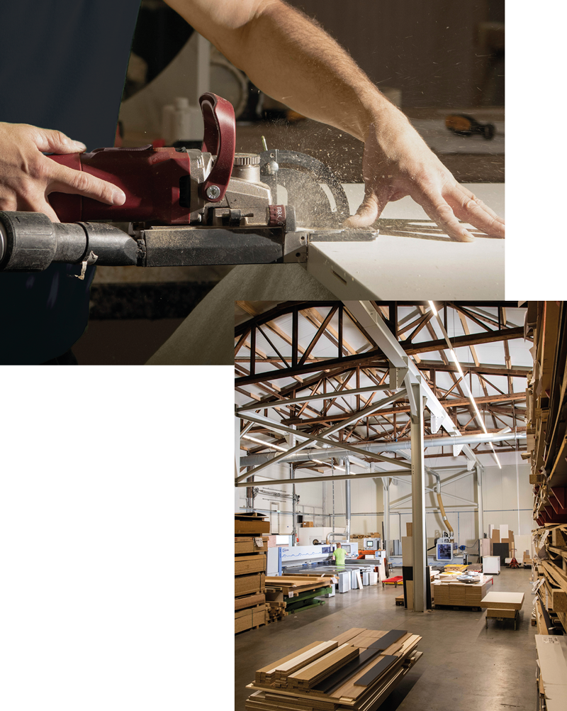 A man is working on a piece of wood in a warehouse.