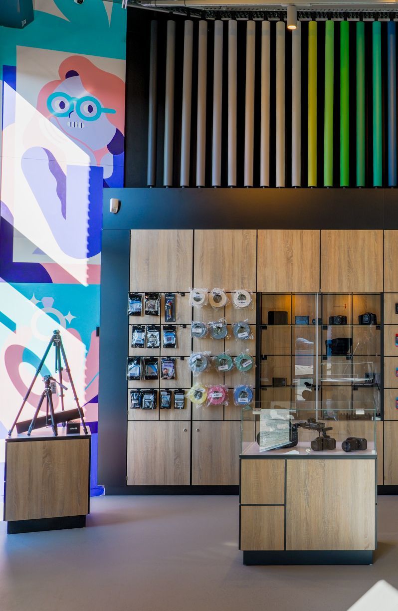 A long bar with stools in a room with a purple floor.