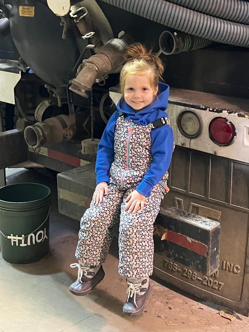 Kid Sitting on a Truck — Marcellus, MI — Richmond Sanitary Service Inc