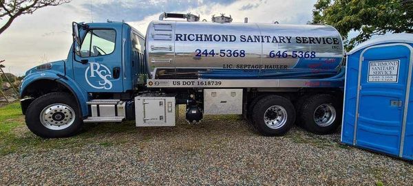 Truck and a Portable Toilet — Marcellus, MI — Richmond Sanitary Service Inc 
