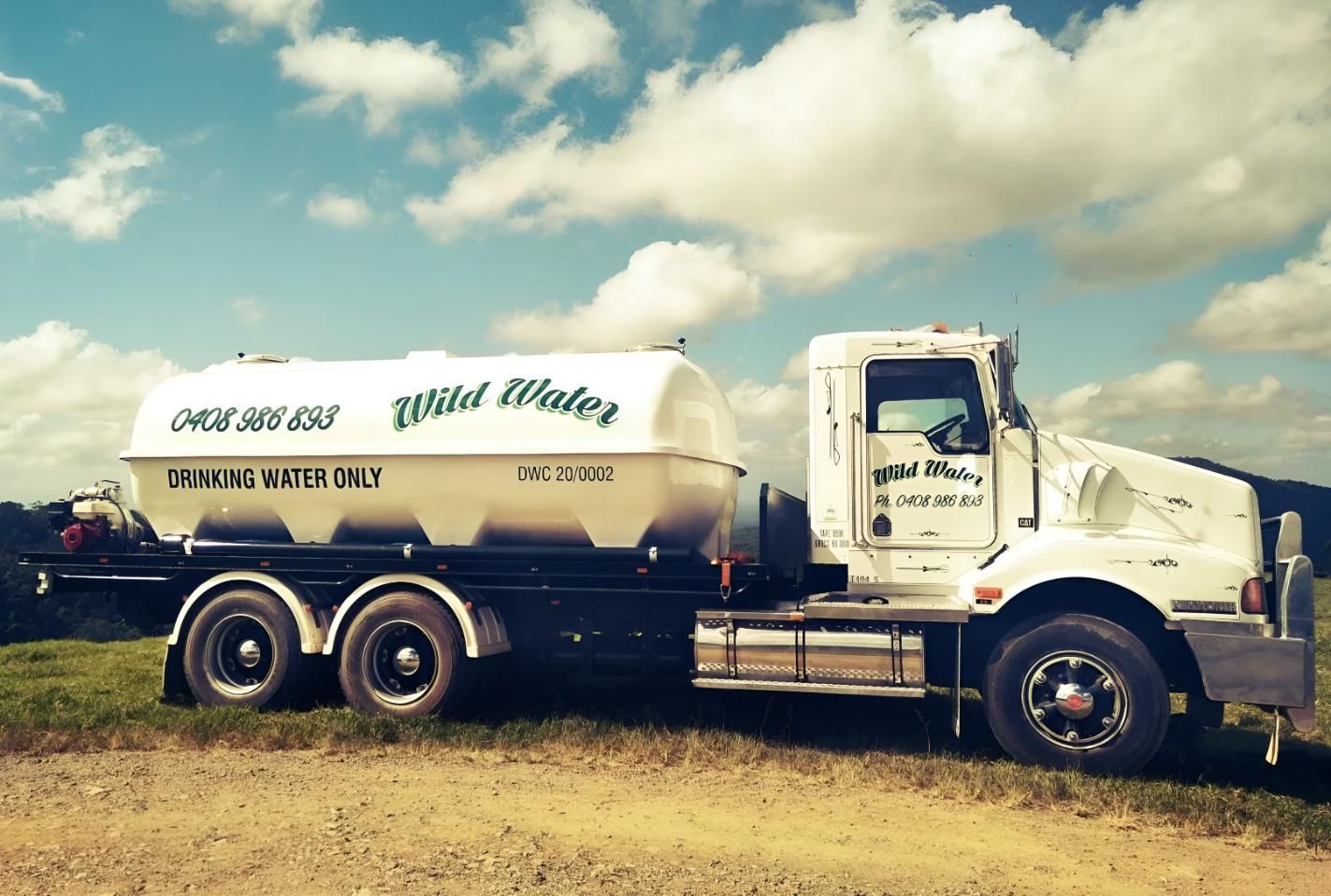 A Wild Water Truck is Parked in a Field — Wild Water Delivery in Bald Knob, QLD