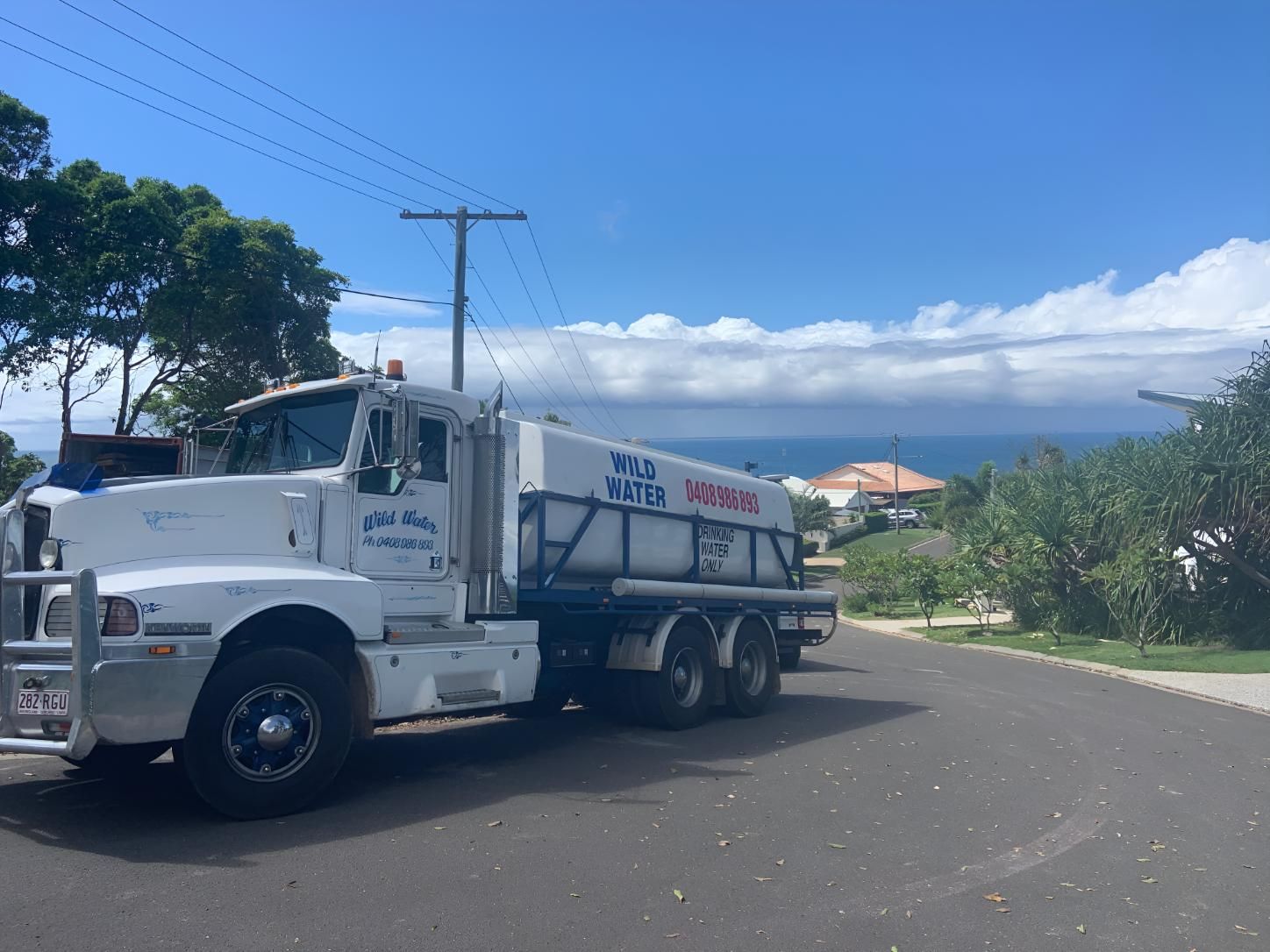 A Large White Truck is Parked on the Side of the Road — Wild Water Delivery in Beerwah, QLD