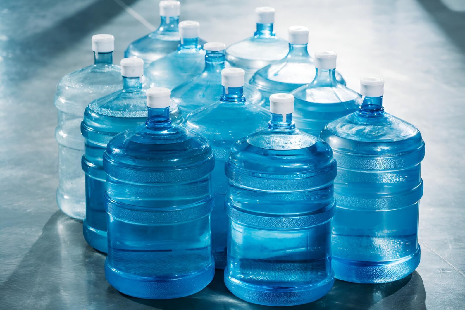 A Bunch of Water Bottles Are Stacked on Top of Each Other — Wild Water Delivery in Montville, QLD