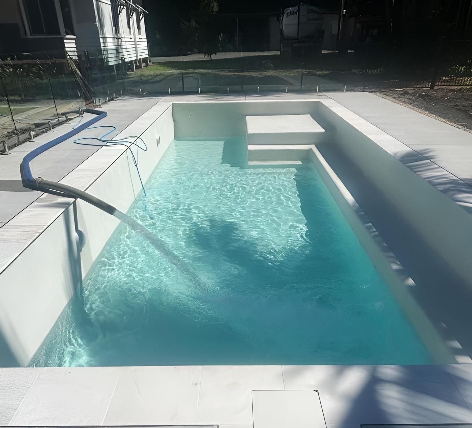 A Swimming Pool With a Hose Coming Out of It — Wild Water Delivery in Montville, QLD