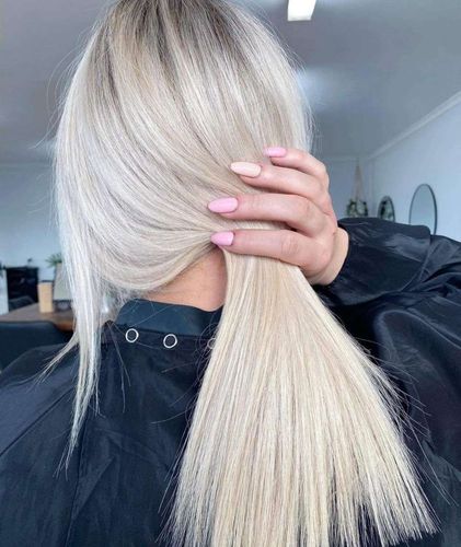 A Woman With Blonde Hair — Innovative Hair Salon in Gosford, NSW