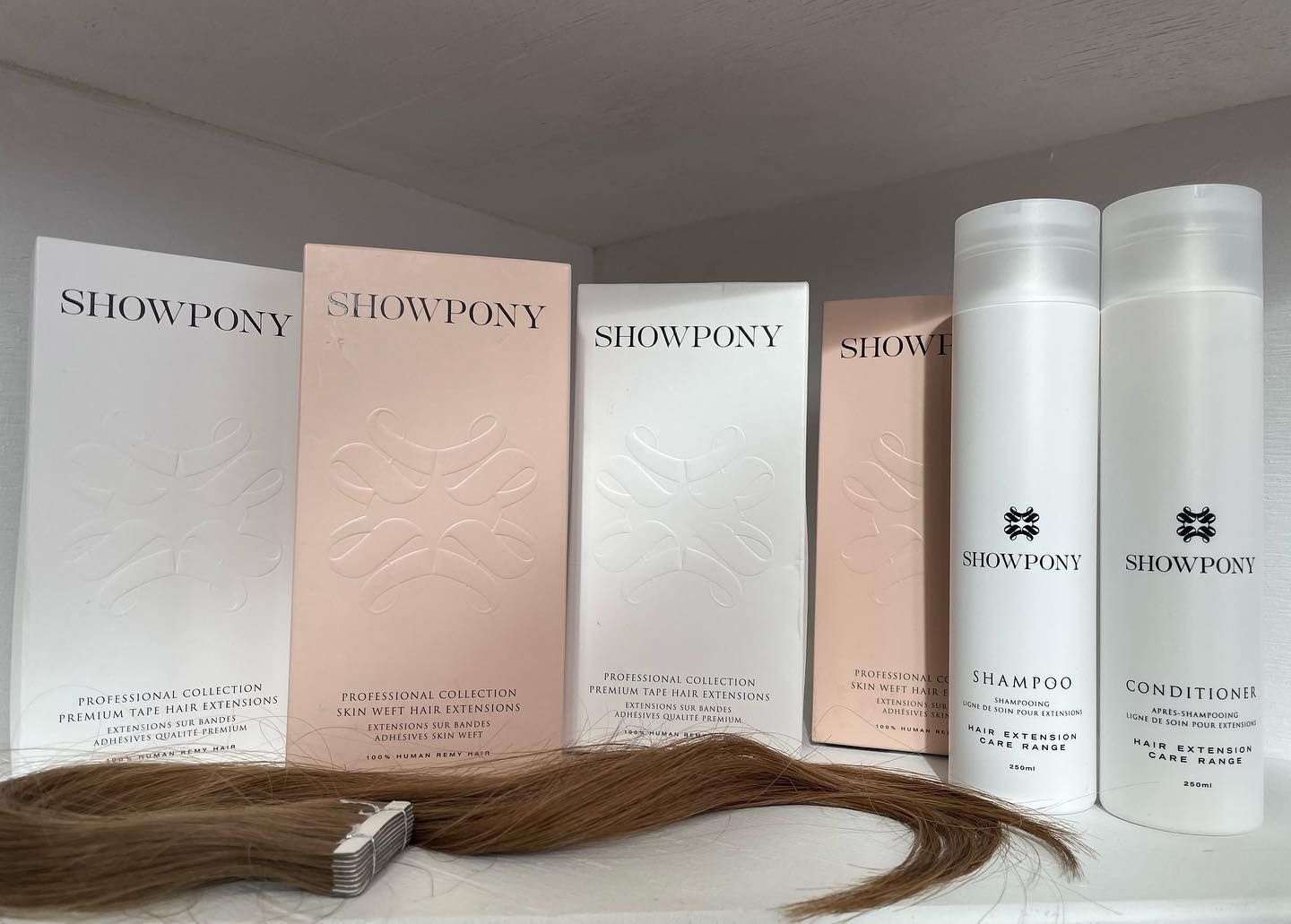 A Bottle of Showpony Shampoo Sits Next to a Box of Showpony Conditioner — Innovative Hair Salon in Gosford, NSW