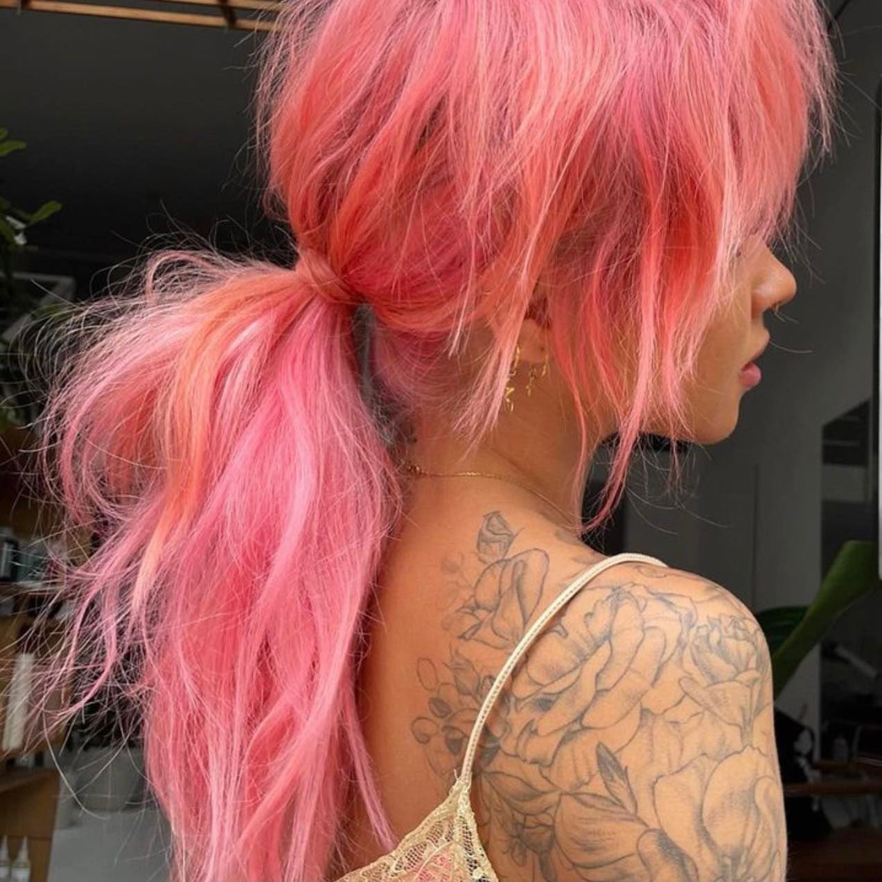 A Woman With Pink Hair Has a Tattoo on Her Back — Custom Hair Foils in Gosford, NSW