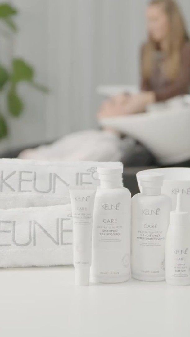 A Woman is Getting Her Hair Washed in a Salon While Sitting in a Sink — Innovative Hair Salon in Gosford, NSW