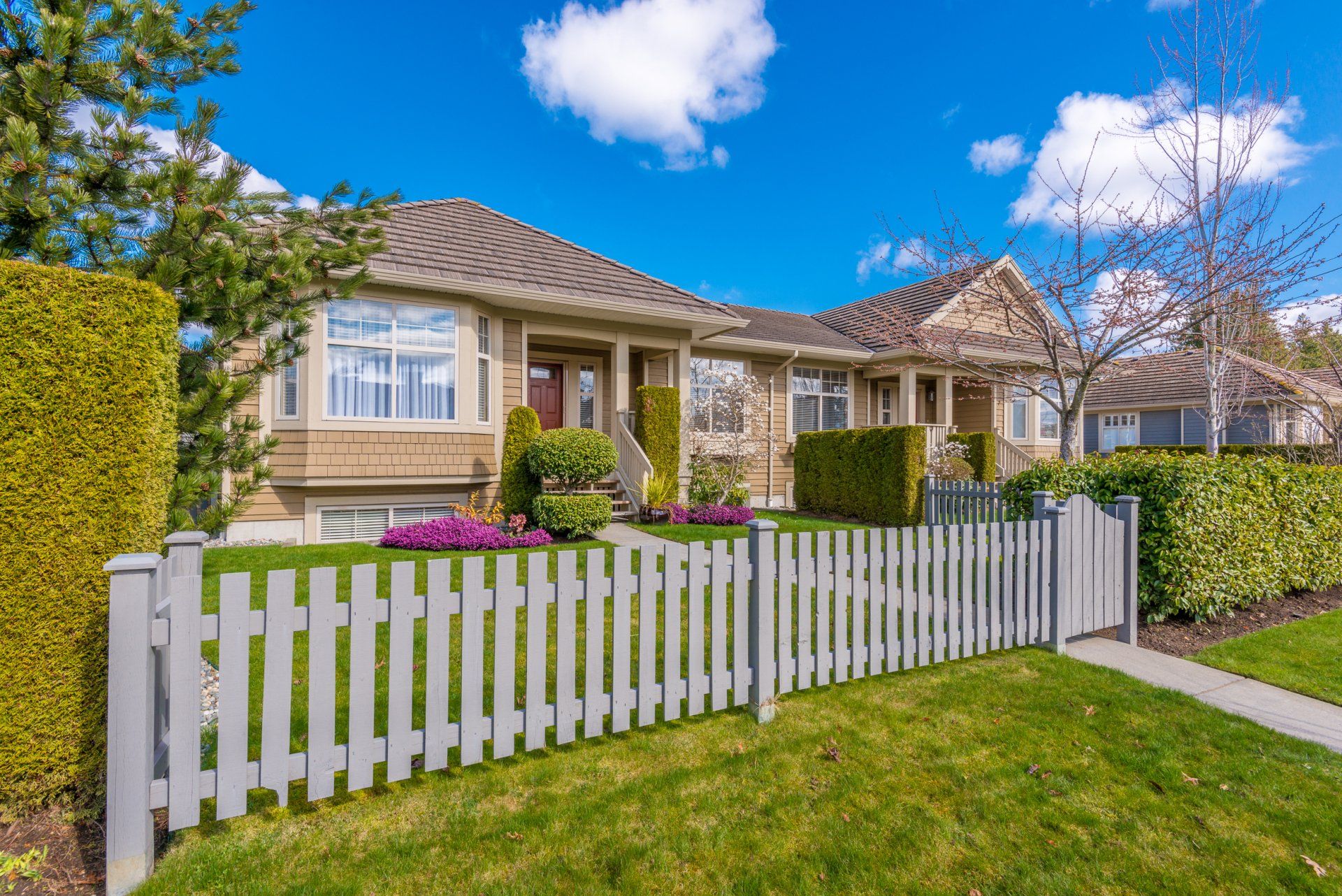 Luxury house against blue sky with white clouds
