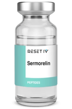 Small vial labeled “RESET IV Sermorelin” with a teal-and-white label and silver cap.