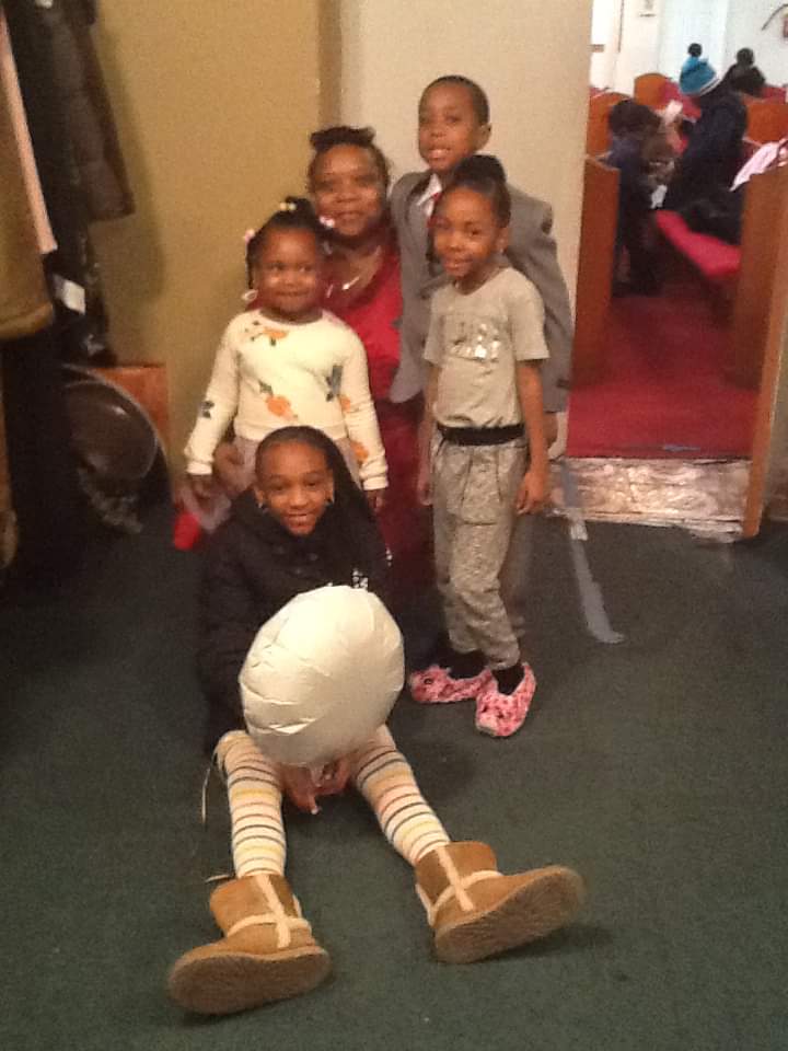 a group of children are posing for a picture in a church