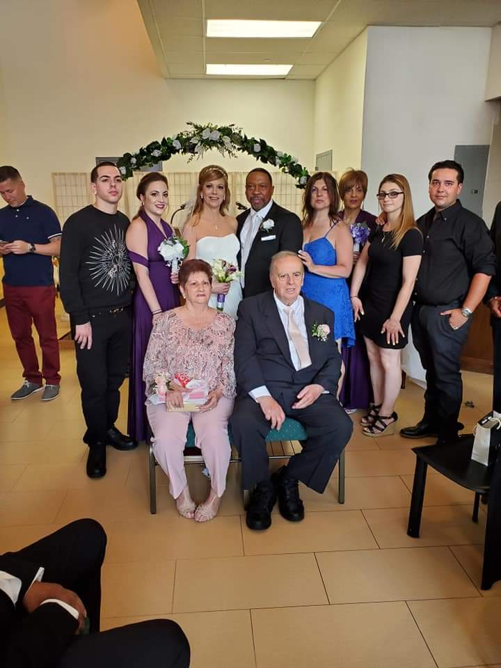 a group of people are posing for a picture in a room .