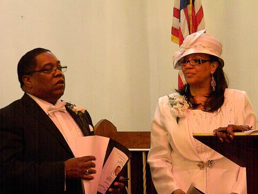 a man and a woman are standing next to each other