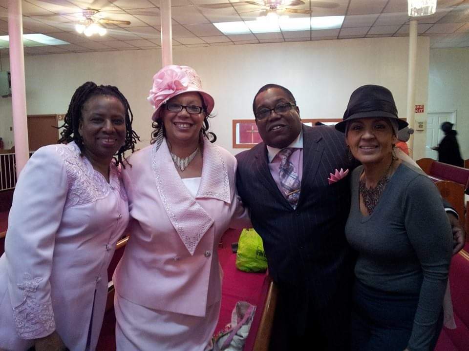 a group of people posing for a picture in a church