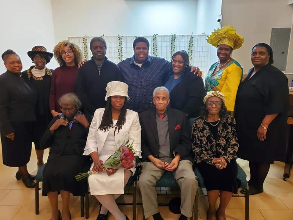 a group of people posing for a picture in a room