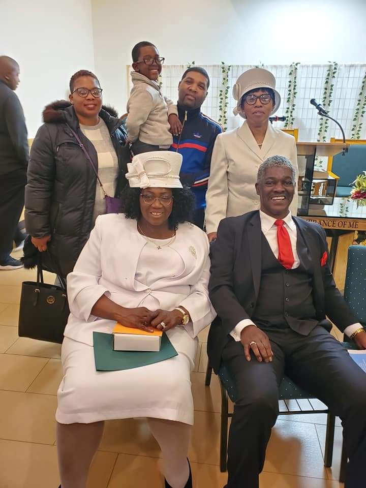 a group of people are posing for a picture in a church .