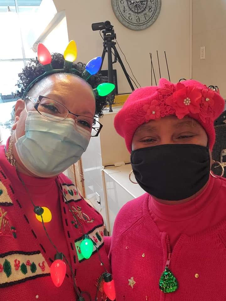 two women wearing face masks are posing for a picture