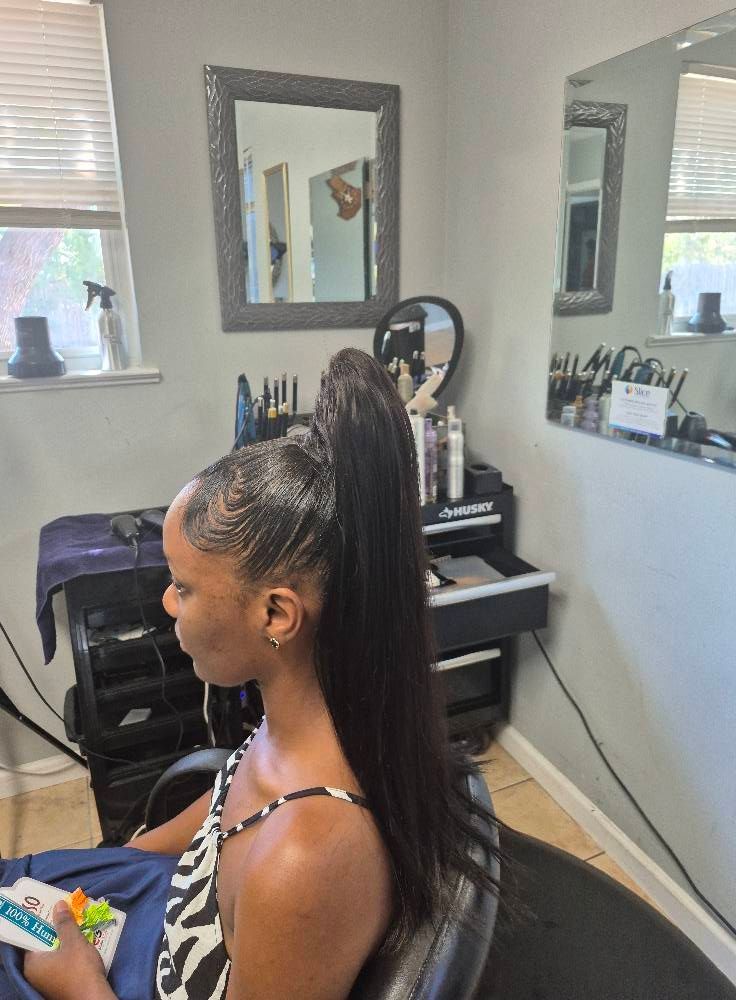 Woman with a high ponytail hairstyle in a salon.