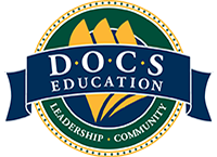 Logo for DOCS Education: dark blue banner over a green circle with gold accents and text: "D.O.C.S EDUCATION" and "LEADERSHIP • COMMUNITY".
