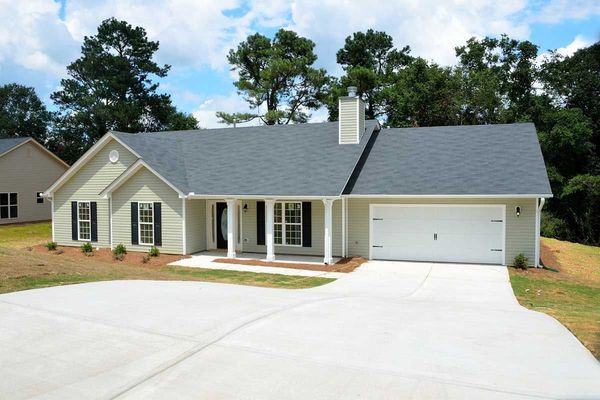 A new concrete driveway in front of a Colorado home.