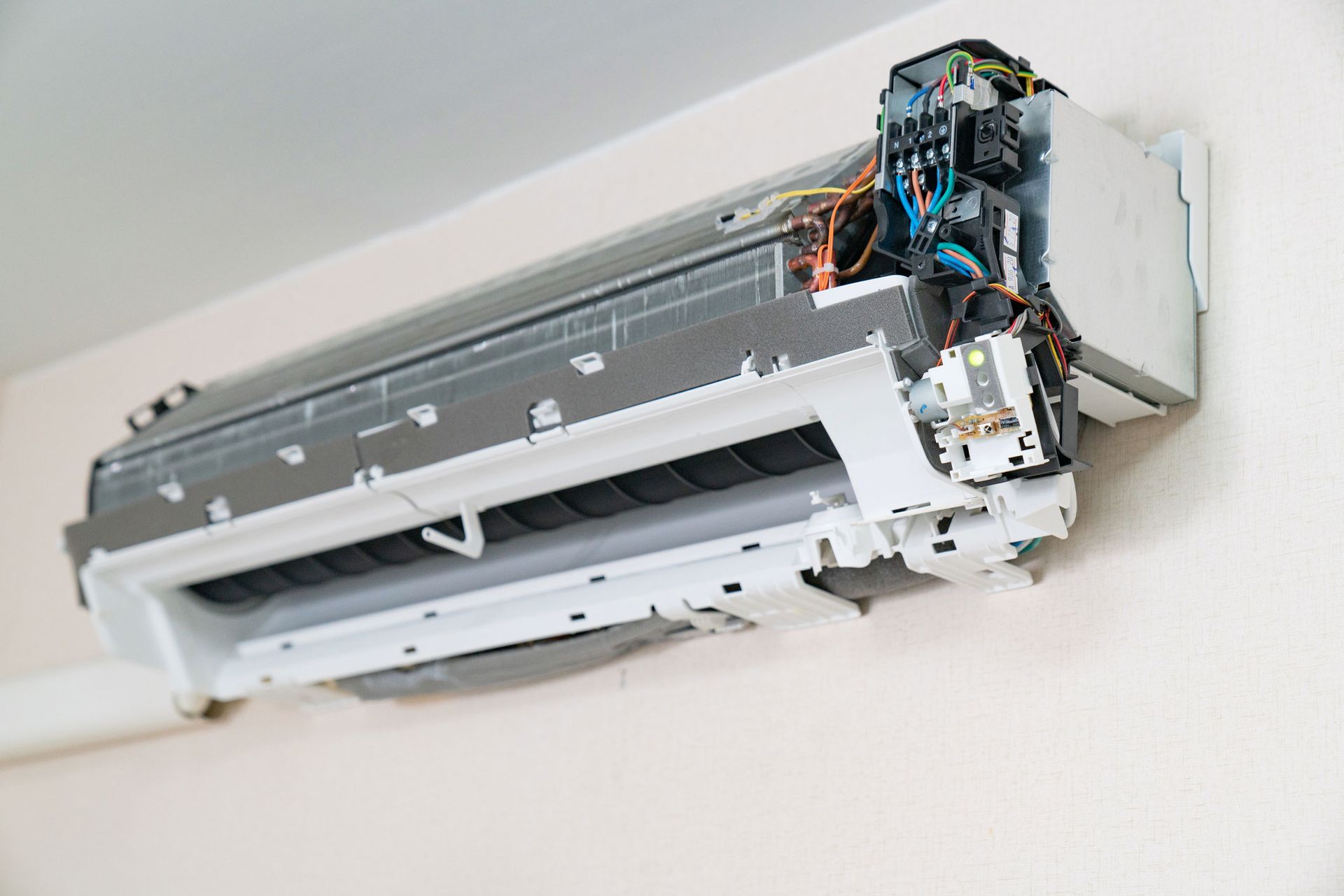 A Close Up Of A Air Conditioner On A Wall | New Bern, NC | ACAR Heating & Air