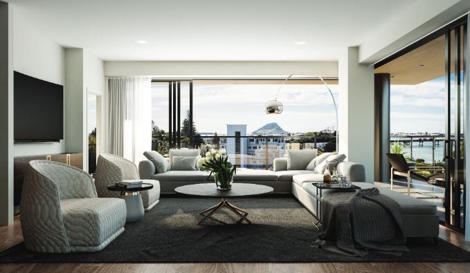 Modern living room with gray furniture, a large window with a city view, and a TV on the wall.