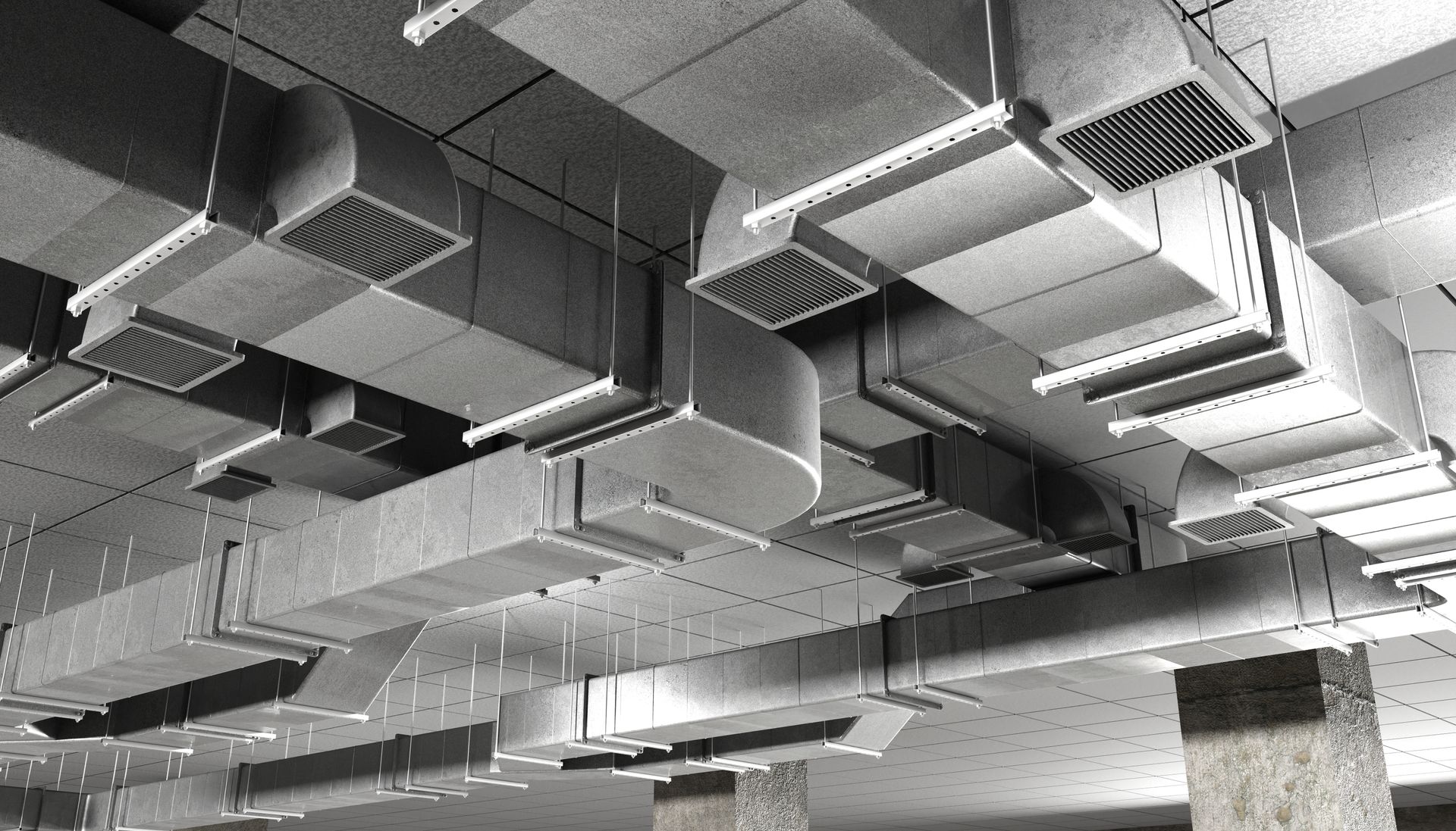 HVAC engineering system with air ducts and ventilation channels installed on the ceiling.