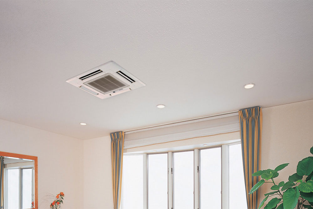 A living room with a ceiling fan and a window.