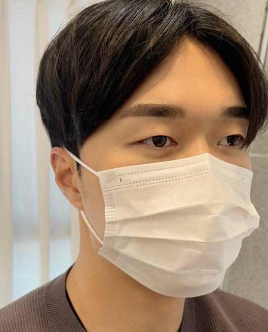 Eyebrow microblading before and after. Eyes closed then open, new brow shape and color. Beige mask.