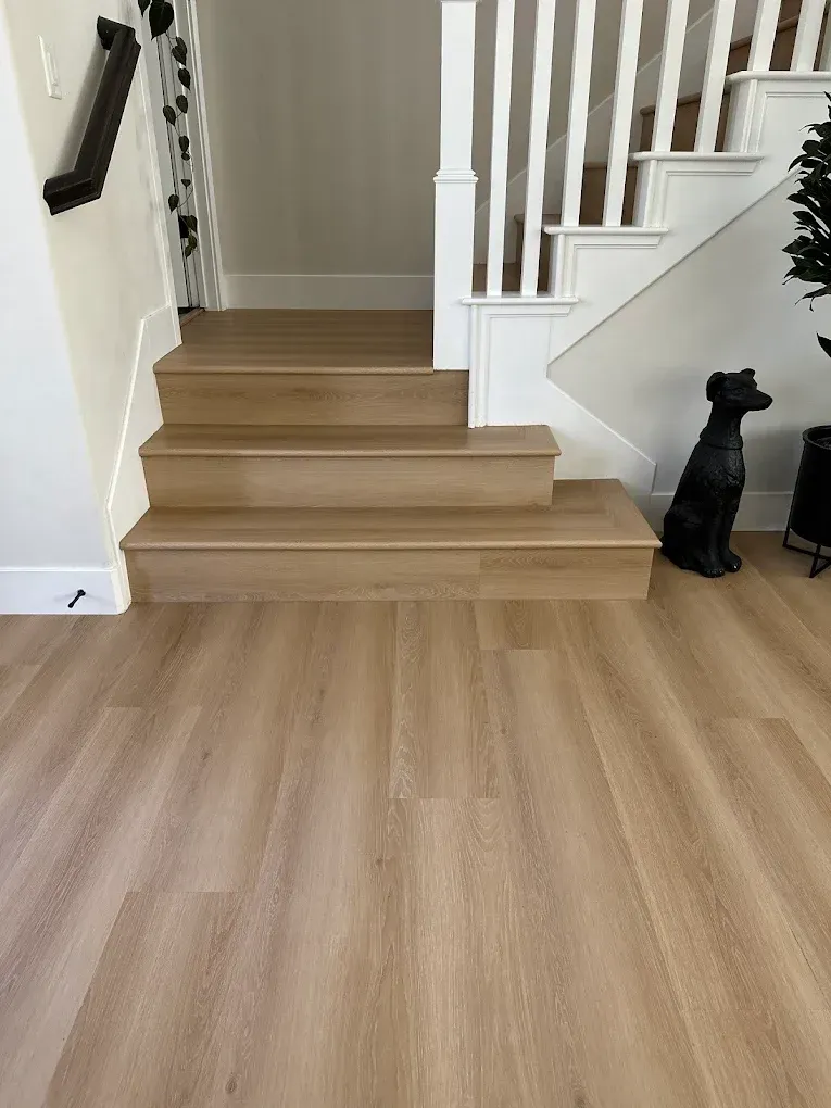 Wide-plank hardwood floor in a warm-toned Sacramento living room