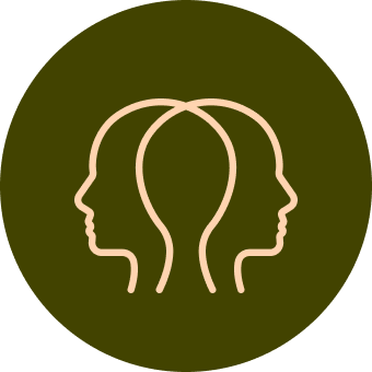 Two connected human head silhouettes, facing opposite directions, in a circle.