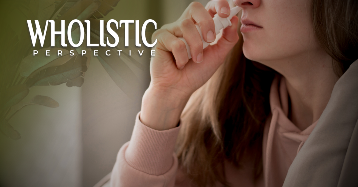 A person uses a nasal spray against a muted green background with the text 